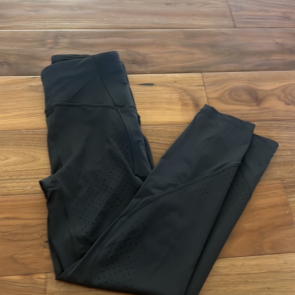 Lululemon gray leggings with dot hole design size 6. Great condition!